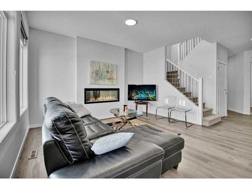 138 Creekside Way Sw, Calgary, AB - Indoor Photo Showing Living Room With Fireplace