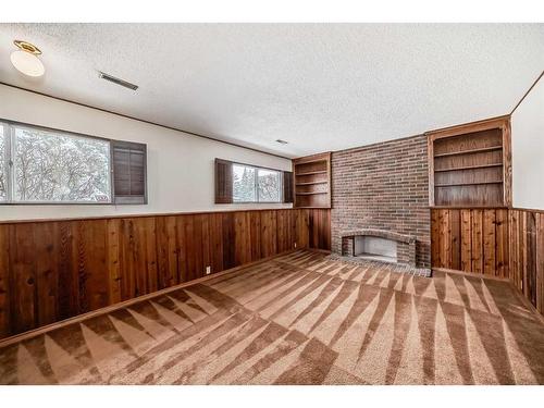 436 Dalmeny Hill Nw, Calgary, AB - Indoor Photo Showing Other Room With Fireplace
