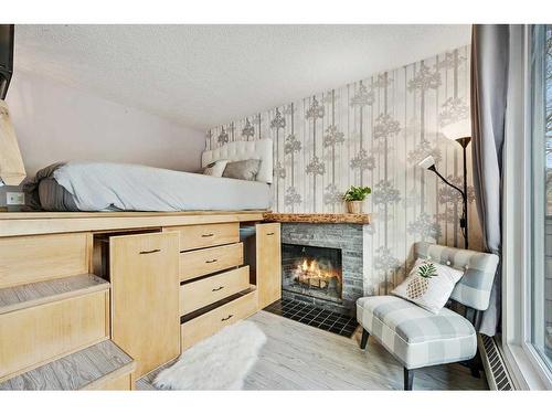 213-414 Squirrel Street, Banff, AB - Indoor With Fireplace