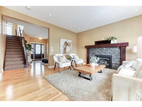 11 Lakes Estates Circle, Strathmore, AB - Indoor Photo Showing Living Room With Fireplace