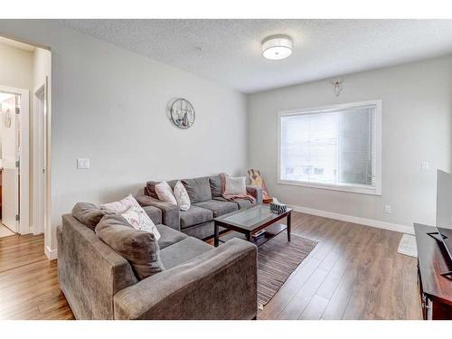 211-12 Sage Hill Terrace Nw, Calgary, AB - Indoor Photo Showing Living Room With Fireplace