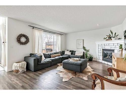 29 Westmount Circle, Okotoks, AB - Indoor Photo Showing Living Room With Fireplace