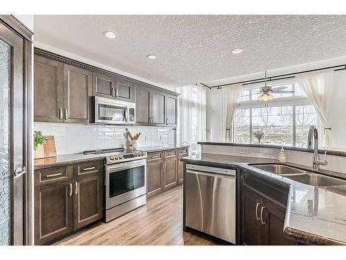 29 Westmount Circle, Okotoks, AB - Indoor Photo Showing Kitchen With Double Sink With Upgraded Kitchen
