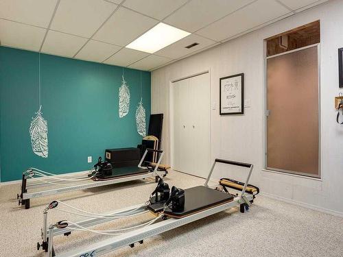 915 Ranch Estates Place Nw, Calgary, AB - Indoor Photo Showing Gym Room