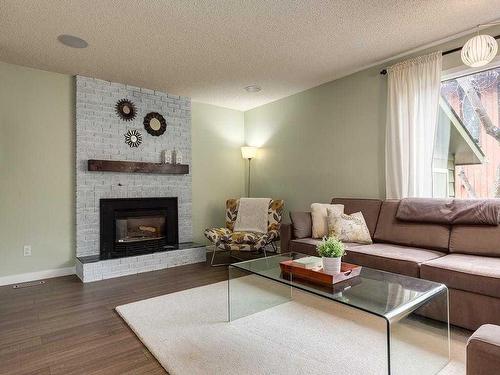 915 Ranch Estates Place Nw, Calgary, AB - Indoor Photo Showing Living Room With Fireplace
