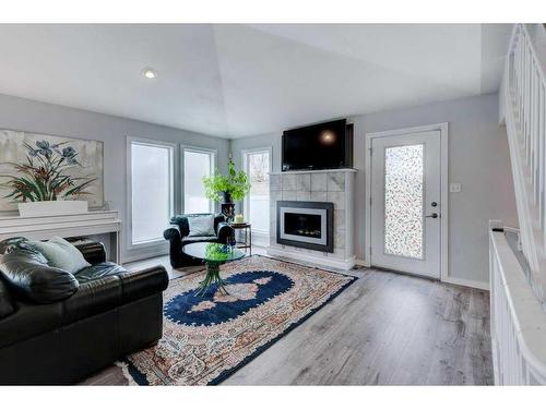 34 Candle Terrace Sw, Calgary, AB - Indoor Photo Showing Living Room With Fireplace