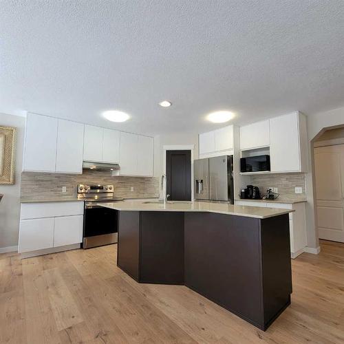 201 Tuscany Ravine Terrace, Calgary, AB - Indoor Photo Showing Kitchen With Upgraded Kitchen