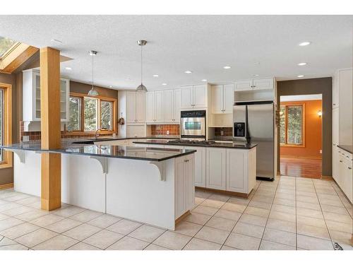 64 Mountain Lion Place, Bragg Creek, AB - Indoor Photo Showing Kitchen With Upgraded Kitchen