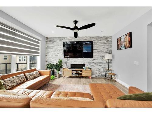 247 Kinniburgh Place, Chestermere, AB - Indoor Photo Showing Living Room With Fireplace