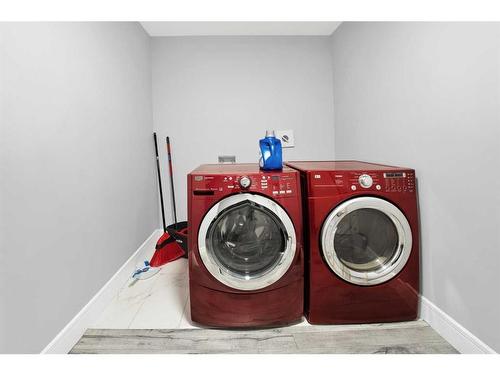 247 Kinniburgh Place, Chestermere, AB - Indoor Photo Showing Laundry Room