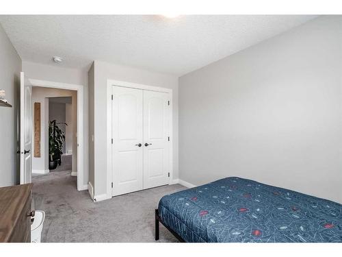 548 Boulder Creek Bay Se, Langdon, AB - Indoor Photo Showing Bedroom