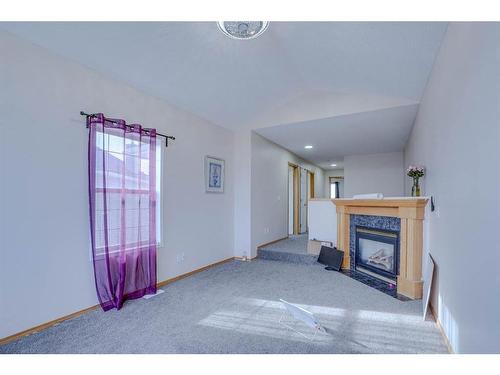 117 Coral Springs Mews Ne, Calgary, AB - Indoor With Fireplace