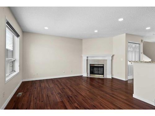 127 Tarington Close Ne, Calgary, AB - Indoor Photo Showing Other Room With Fireplace