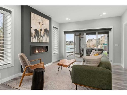 131 Marine Drive Se, Calgary, AB - Indoor Photo Showing Living Room With Fireplace