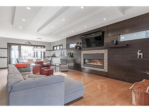 127 35 Street Nw, Calgary, AB - Indoor Photo Showing Living Room With Fireplace