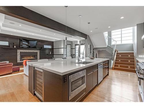 127 35 Street Nw, Calgary, AB - Indoor Photo Showing Kitchen With Fireplace
