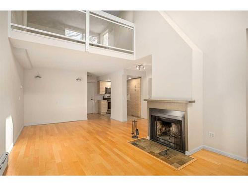 103-2214 14A Street Sw, Calgary, AB - Indoor With Fireplace