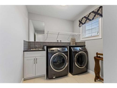 24 Mount Rae Terrace, Okotoks, AB - Indoor Photo Showing Laundry Room