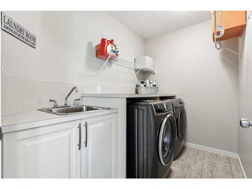 191 West Grove Way Sw, Calgary, AB - Indoor Photo Showing Laundry Room