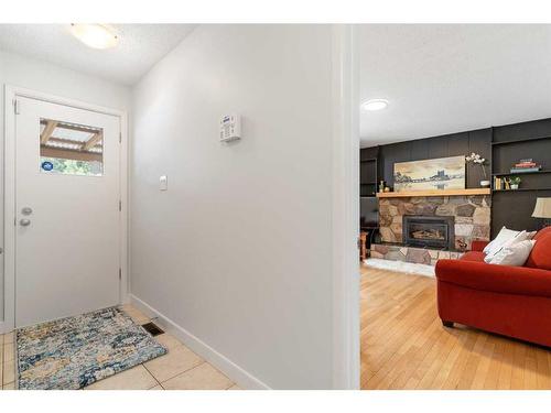 2419 Usher Road Nw, Calgary, AB - Indoor With Fireplace