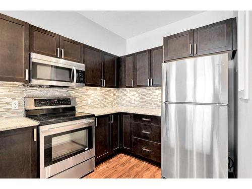 106-4303 1 Street Ne, Calgary, AB - Indoor Photo Showing Kitchen With Stainless Steel Kitchen