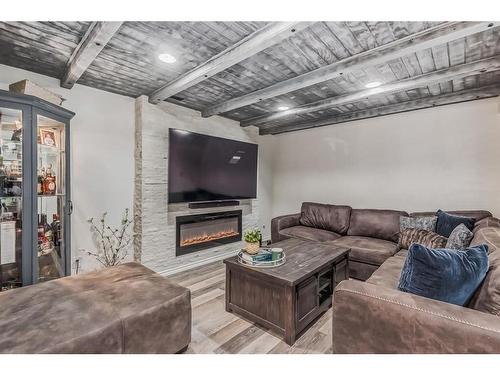28 Abadan Crescent Ne, Calgary, AB - Indoor Photo Showing Living Room With Fireplace