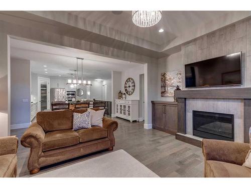 60 Cranbrook Landing Se, Calgary, AB - Indoor Photo Showing Living Room With Fireplace