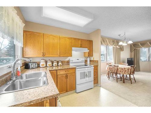 2727 Dovely Park Se, Calgary, AB - Indoor Photo Showing Kitchen With Double Sink