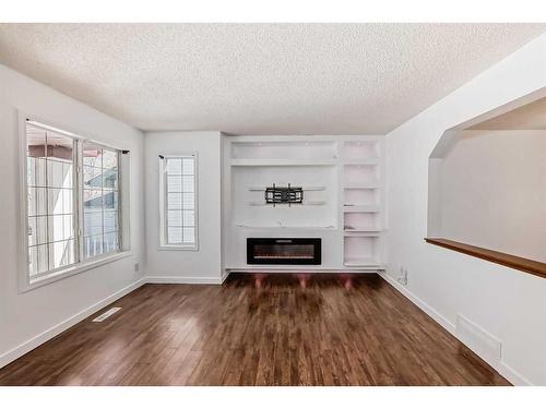42 Bridlecreek Park Sw, Calgary, AB - Indoor With Fireplace