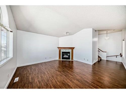 42 Bridlecreek Park Sw, Calgary, AB - Indoor Photo Showing Living Room With Fireplace