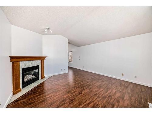 42 Bridlecreek Park Sw, Calgary, AB - Indoor With Fireplace