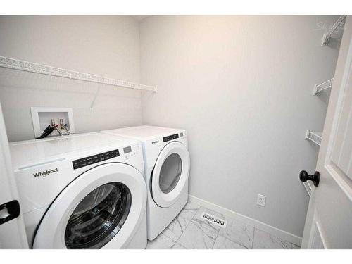 113 Midtown Close Sw, Airdrie, AB - Indoor Photo Showing Laundry Room
