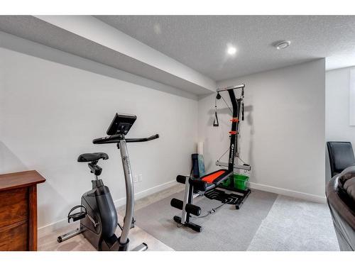 3 Larkspur Bend, Okotoks, AB - Indoor Photo Showing Gym Room