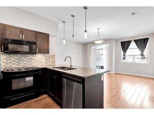 421-4303 1 Street Ne, Calgary, AB - Indoor Photo Showing Kitchen With Double Sink With Upgraded Kitchen