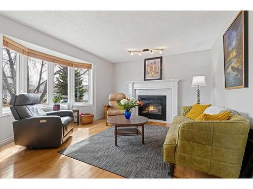 909 17 Street Se, High River, AB - Indoor Photo Showing Living Room With Fireplace