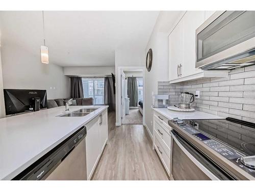 310-150 Auburn Meadows Manor Se, Calgary, AB - Indoor Photo Showing Kitchen With Double Sink With Upgraded Kitchen