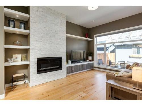 2236 Bowness Road Nw, Calgary, AB - Indoor Photo Showing Living Room With Fireplace