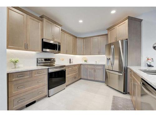 99 Ridge View Close, Cochrane, AB - Indoor Photo Showing Kitchen With Stainless Steel Kitchen With Upgraded Kitchen