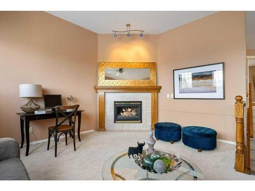 54 Chapala Crescent Se, Calgary, AB - Indoor Photo Showing Other Room With Fireplace