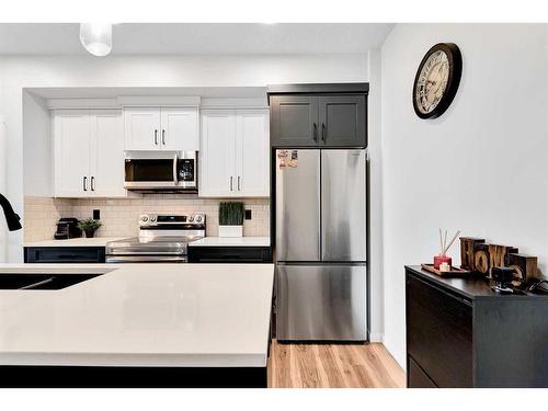 205-80 Carrington Plaza Nw, Calgary, AB - Indoor Photo Showing Kitchen With Stainless Steel Kitchen With Upgraded Kitchen