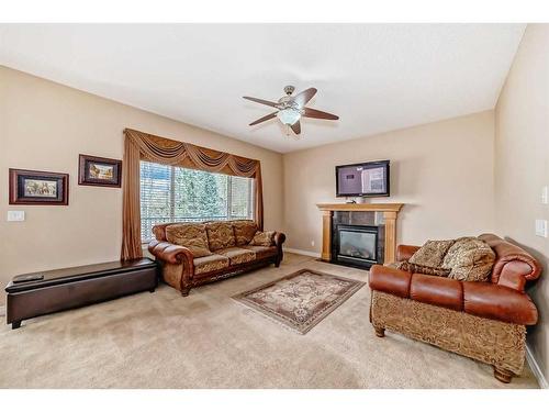 157 Everwoods Close Sw, Calgary, AB - Indoor Photo Showing Living Room With Fireplace
