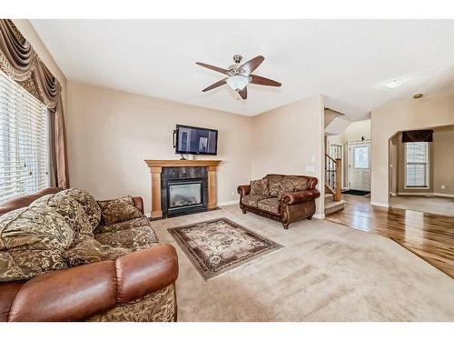 157 Everwoods Close Sw, Calgary, AB - Indoor Photo Showing Living Room With Fireplace