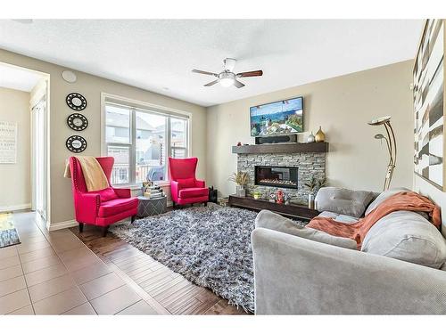 2112 Brightoncrest Green Se, Calgary, AB - Indoor Photo Showing Living Room With Fireplace