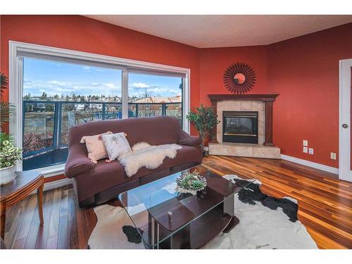32 Hawkmount Heights Nw, Calgary, AB - Indoor Photo Showing Living Room With Fireplace