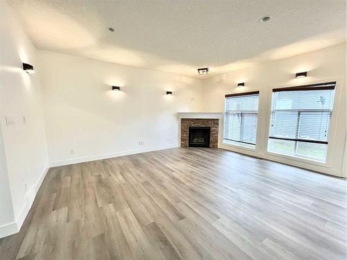 389 Northmount Drive Nw, Calgary, AB - Indoor Photo Showing Living Room With Fireplace