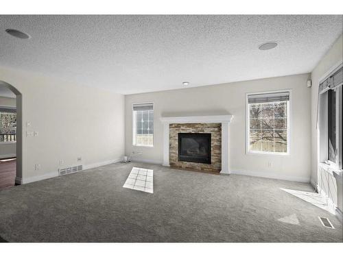 186 Everwillow Close Sw, Calgary, AB - Indoor Photo Showing Living Room With Fireplace