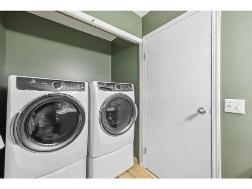 128 Country Hills Way Nw, Calgary, AB - Indoor Photo Showing Laundry Room