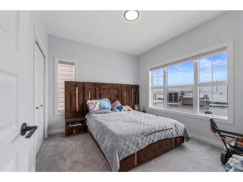 932 Bayview Rise Sw, Airdrie, AB - Indoor Photo Showing Bedroom