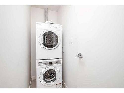 403-138 Waterfront Court Sw, Calgary, AB - Indoor Photo Showing Laundry Room