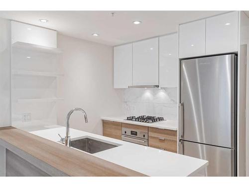 403-138 Waterfront Court Sw, Calgary, AB - Indoor Photo Showing Kitchen With Upgraded Kitchen